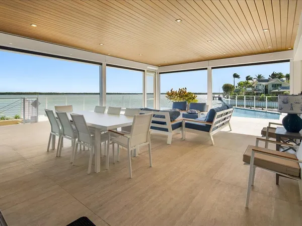 a outdoor space with the couches and dining table