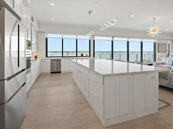 a kitchen with a sink and large window