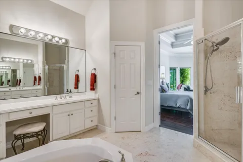 a spacious bathroom with a shower and a sink