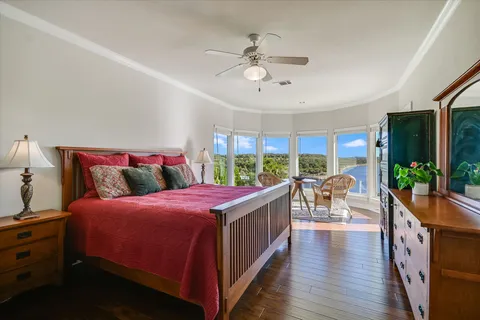 a bed room with bed and a large window
