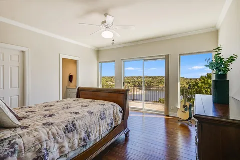 a bedroom with a large bed and a large window