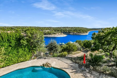 a view of a lake with a yard