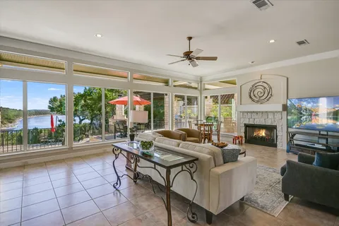 a living room with furniture and a fireplace