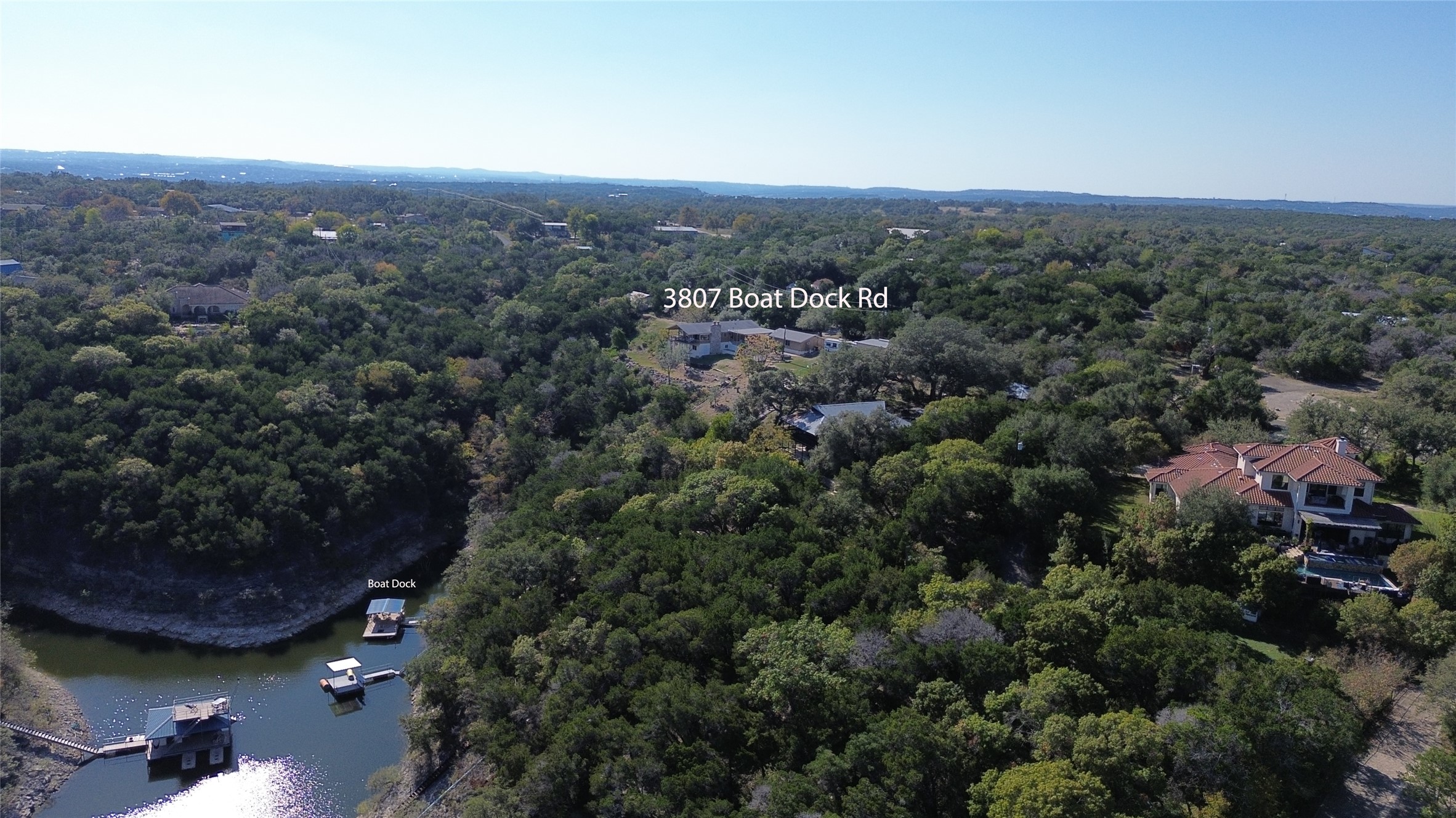 3807 Boat Dock Road Lago Vista, TX 78645 - Photo 31 of 37 Panoramic views of lush landscape and a private boat dock offer an idyllic waterfront lifestyle.