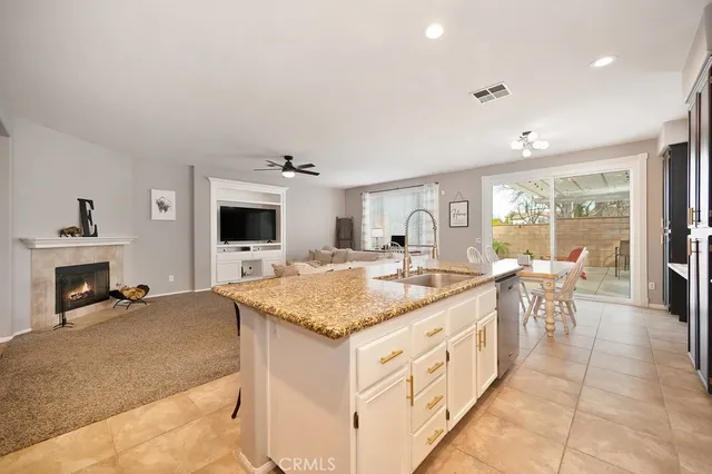 a kitchen with a stove and a white cabinets