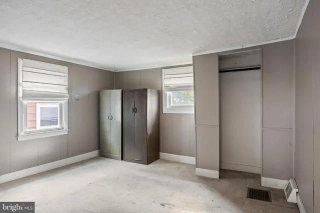 an empty room with windows