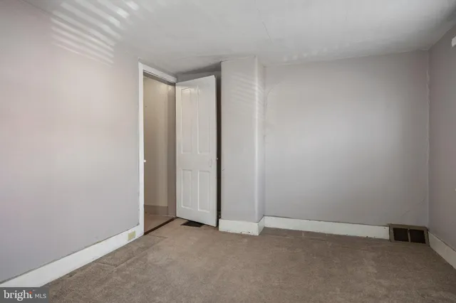 a view of a room with stairs and a rug