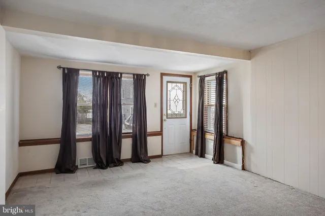 an empty room with windows