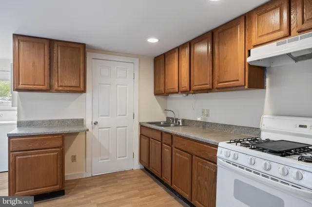 a kitchen with a stove and cabinets