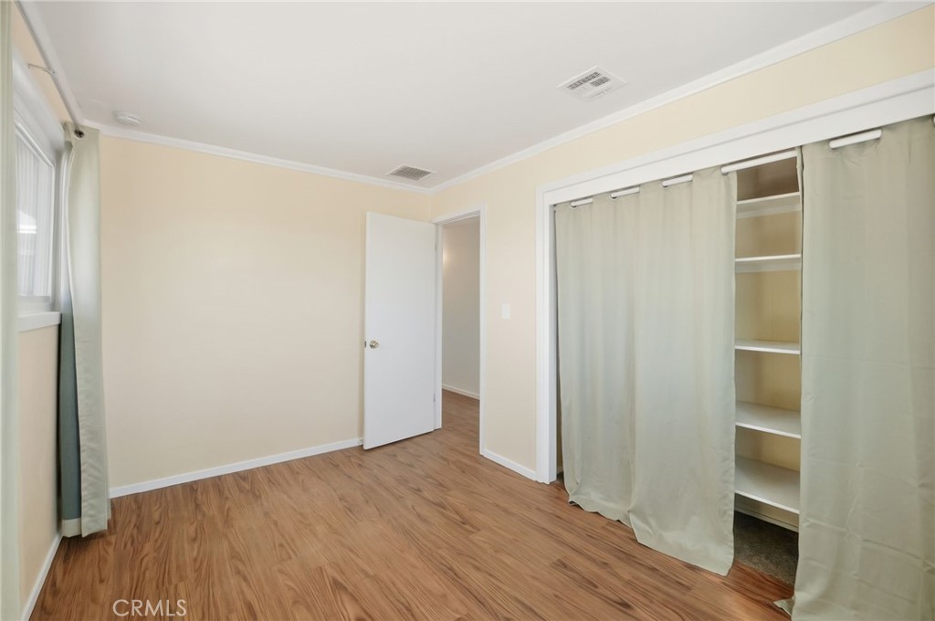 66270 Brant Crossing Road Joshua Tree, CA 92252 - Photo 21 of 46 a view of empty room with wooden floor
