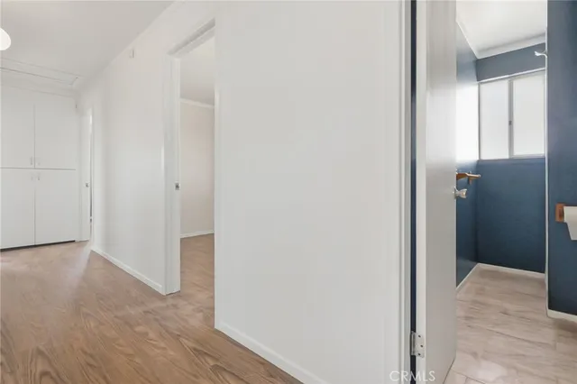 a large kitchen with stainless steel appliances granite countertop a sink a stove cabinets and a dining table