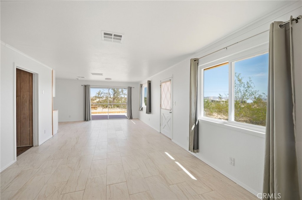 66270 Brant Crossing Road Joshua Tree, CA 92252 - Photo 28 of 46 a view of an empty room with a window