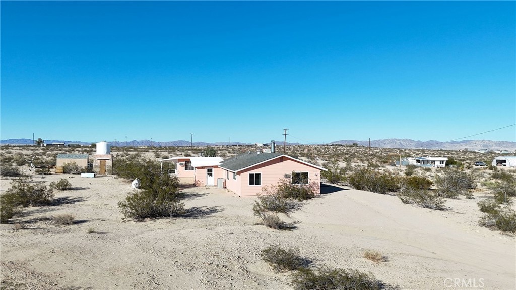 66270 Brant Crossing Road Joshua Tree, CA 92252 - Photo 41 of 46 a view of a terrace with a road