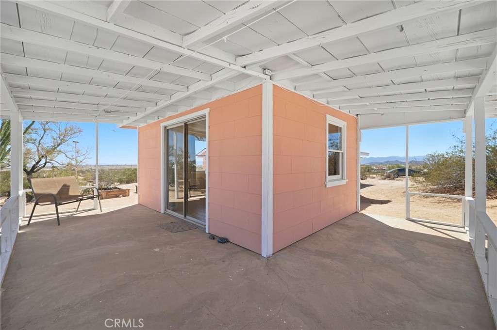 66270 Brant Crossing Road Joshua Tree, CA 92252 - Photo 7 of 46 a view of an empty room with a large window