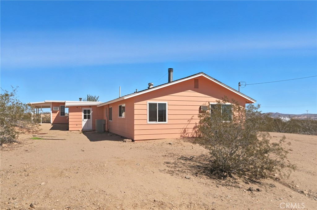 66270 Brant Crossing Road Joshua Tree, CA 92252 - Photo 10 of 46 a view of a house with a snow in the background