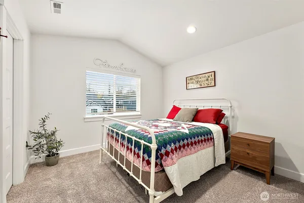 a bed room with a bed and a window