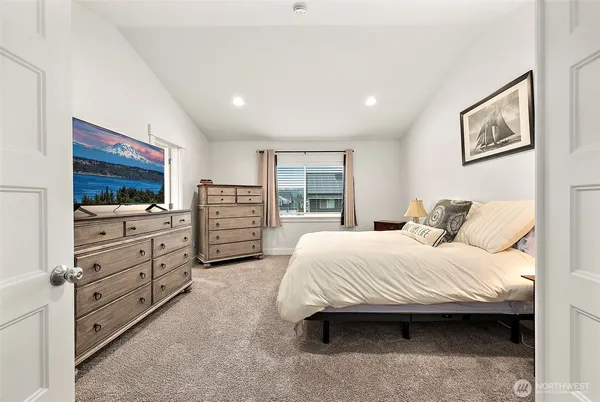 a bedroom with a bed and furniture