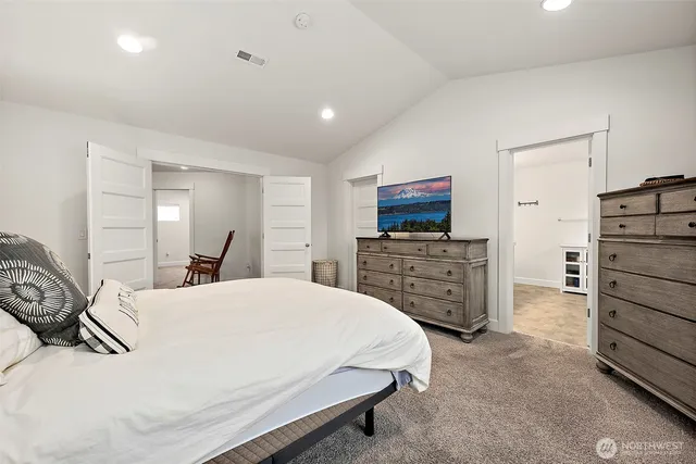 a bedroom with a bed and furniture