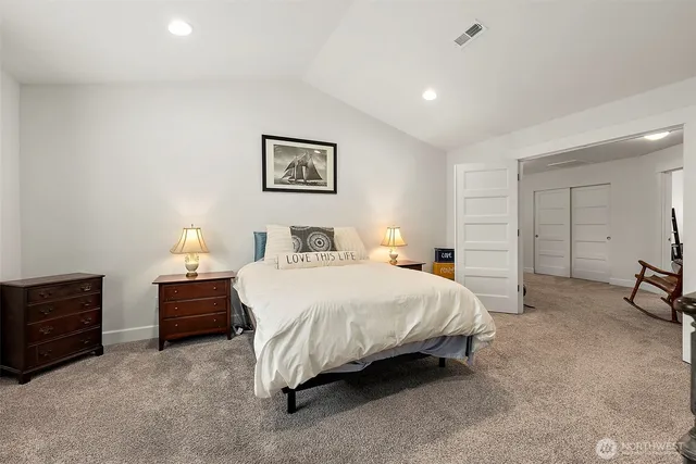 a bedroom with a bed and dresser