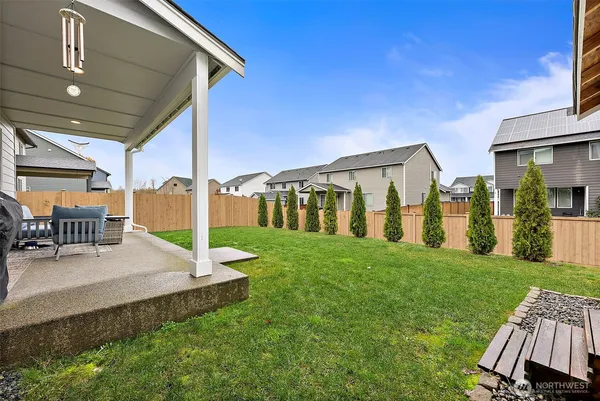 a view of a house with backyard porch and sitting area