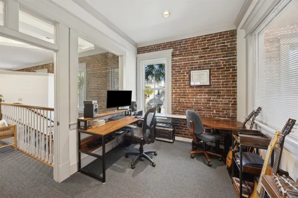 a workspace with furniture and a fireplace