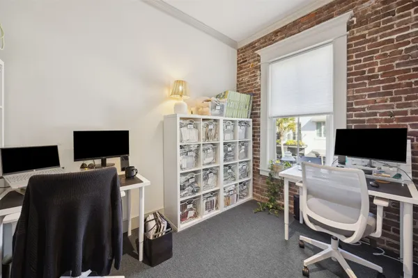 a bathroom with a sink a toilet and shower curtain