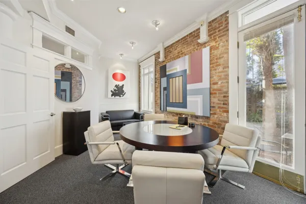 a living room with furniture and a table