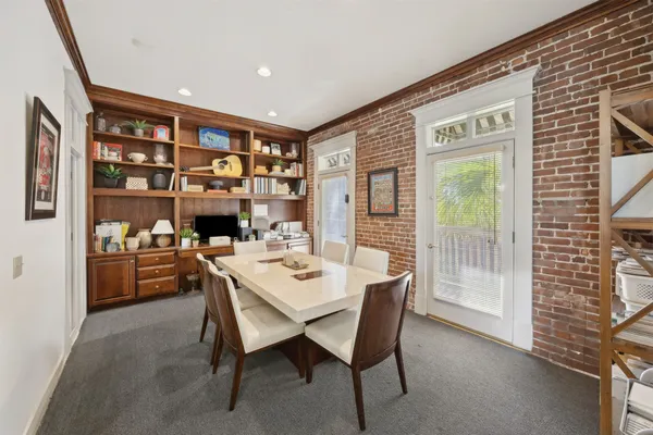 a view of a livingroom with furniture and windows