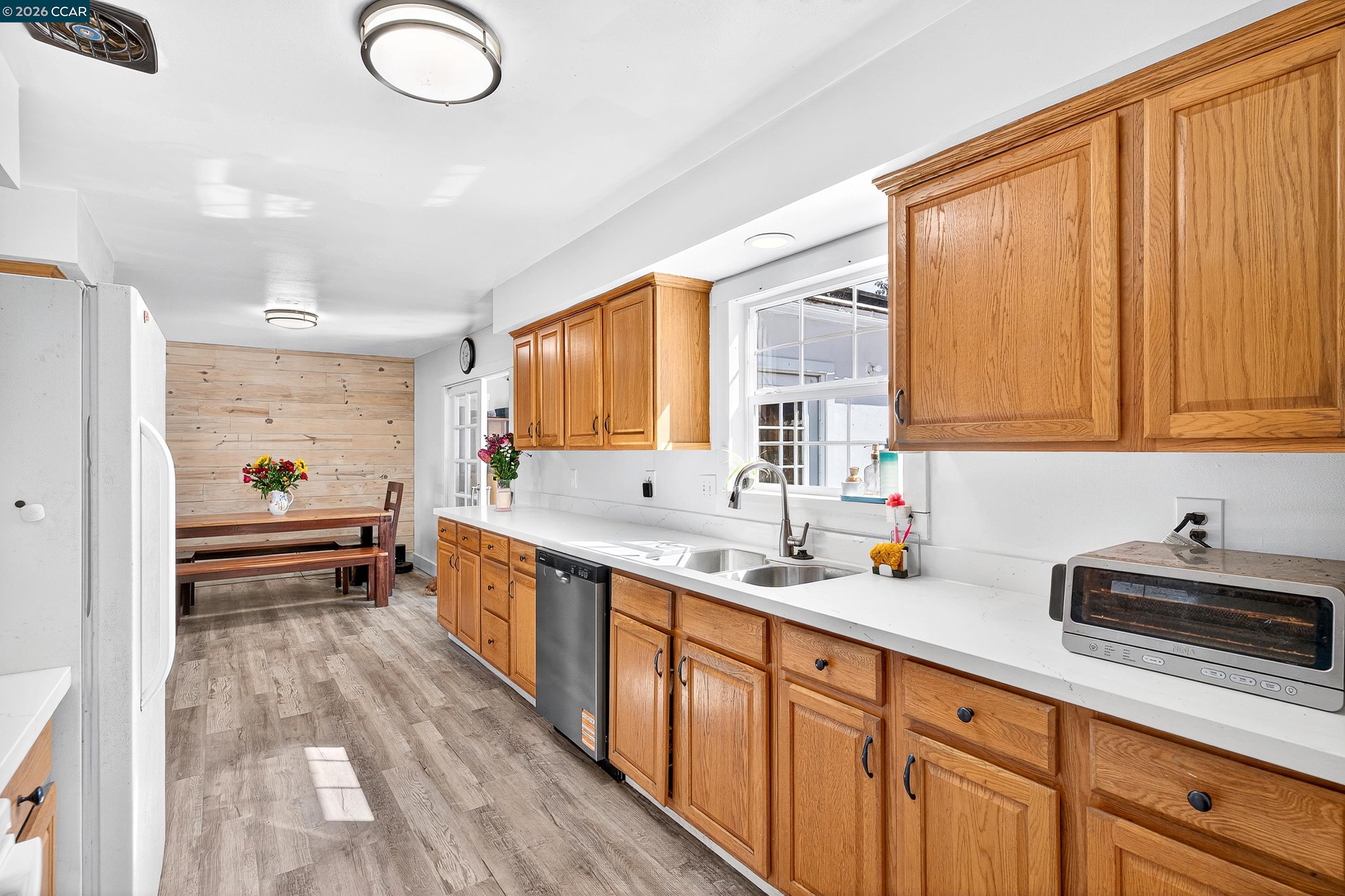 2312 Granada Court Pinole, CA 94564 - Photo 13 of 60 a kitchen with stainless steel appliances a sink stove and cabinets