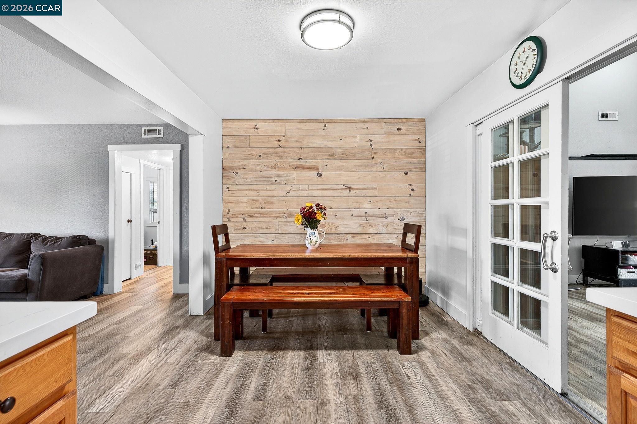 2312 Granada Court Pinole, CA 94564 - Photo 15 of 60 a living room with wooden floor and a book shelf