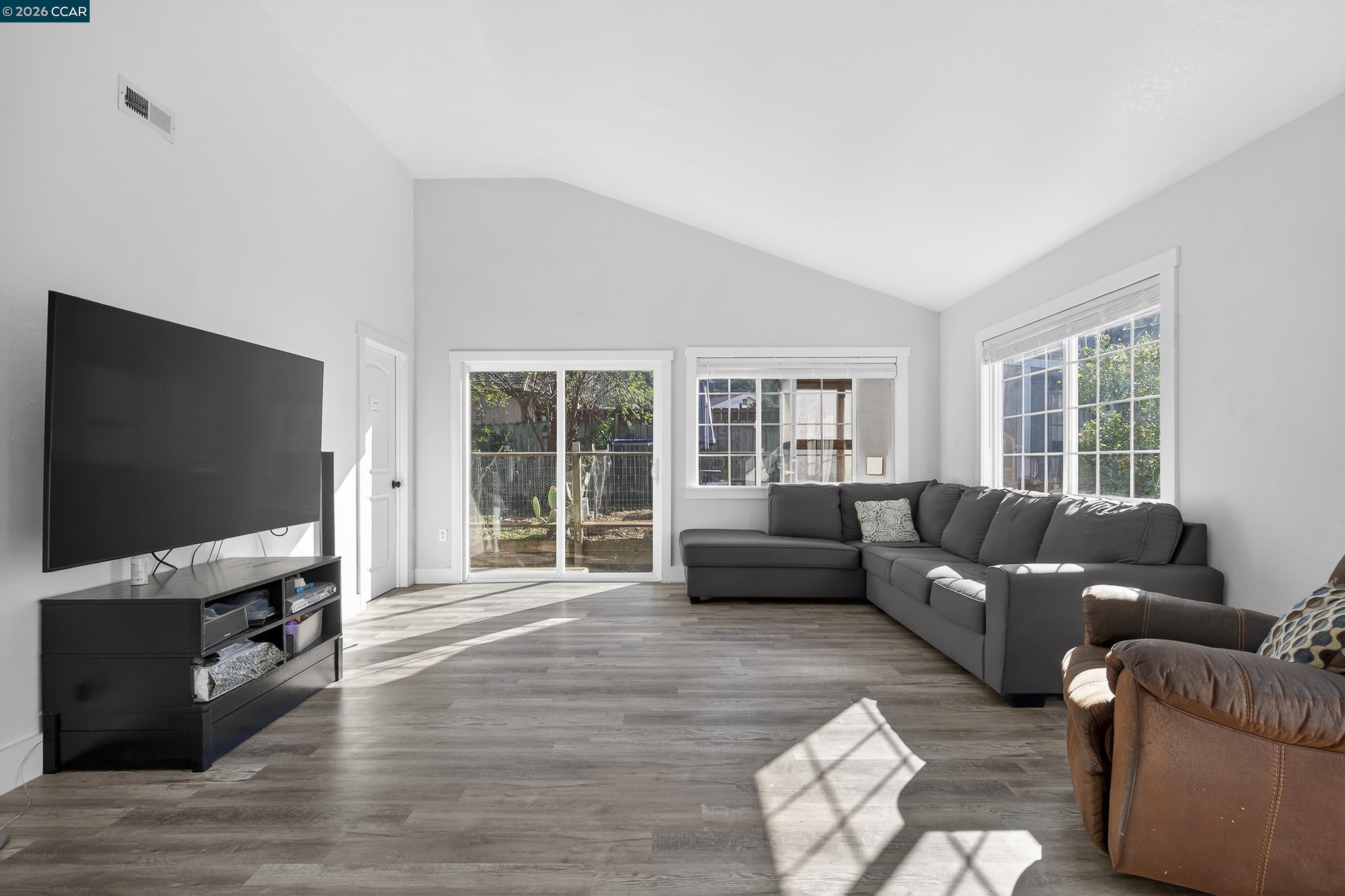 2312 Granada Court Pinole, CA 94564 - Photo 18 of 60 a living room with furniture and a flat screen tv