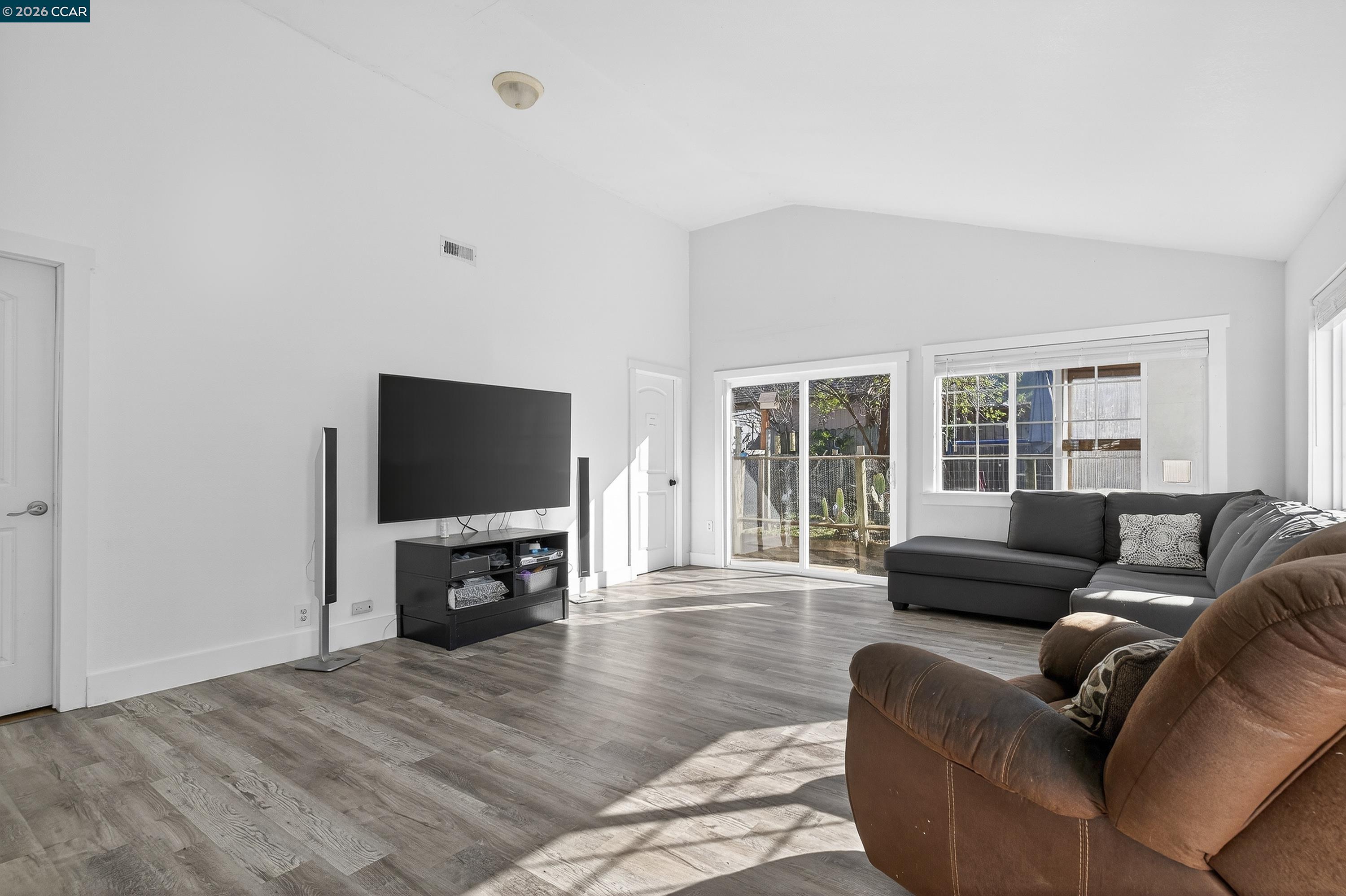 2312 Granada Court Pinole, CA 94564 - Photo 19 of 60 a living room with furniture and a flat screen tv