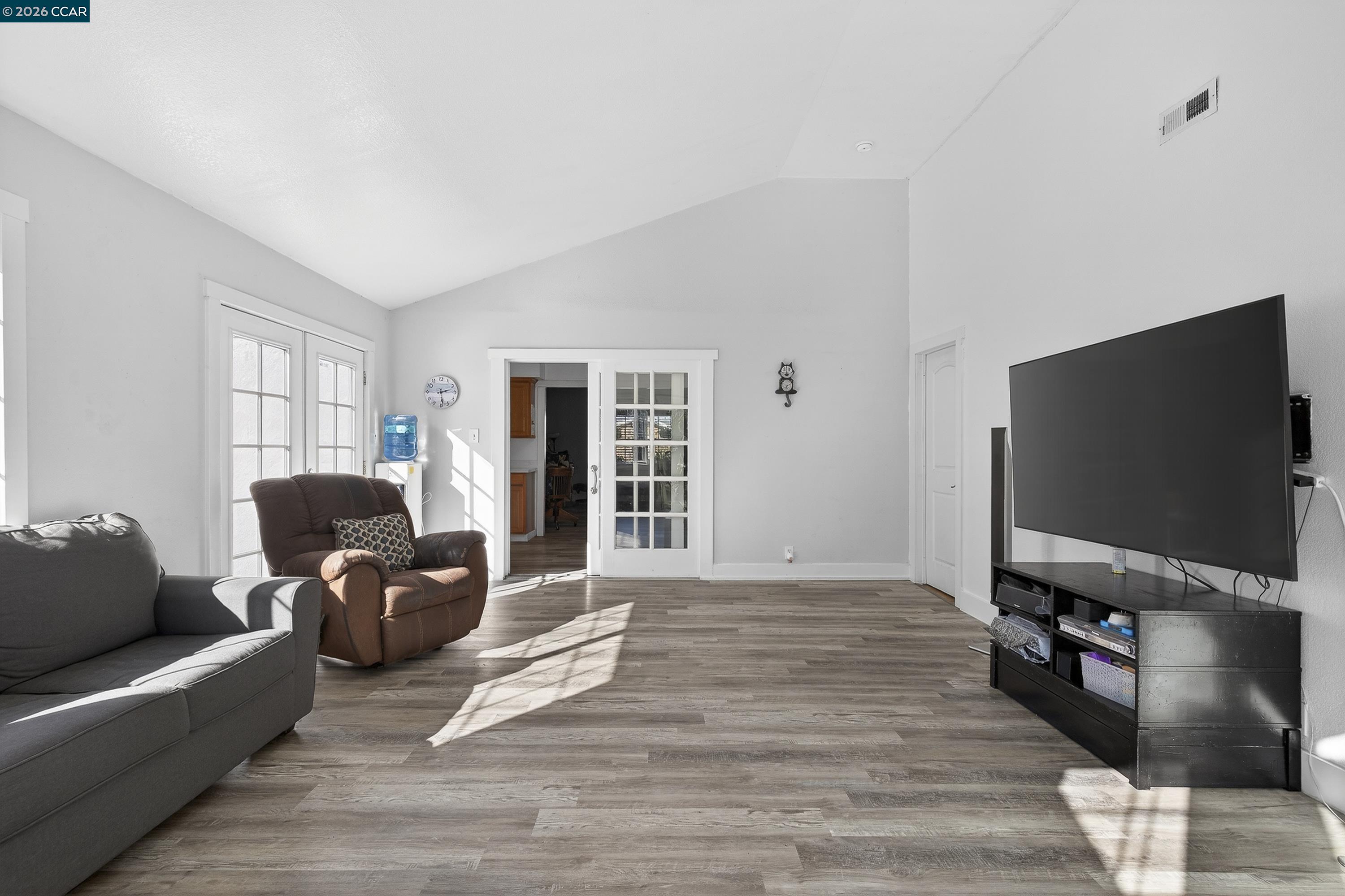 2312 Granada Court Pinole, CA 94564 - Photo 21 of 60 a living room with furniture and a flat screen tv