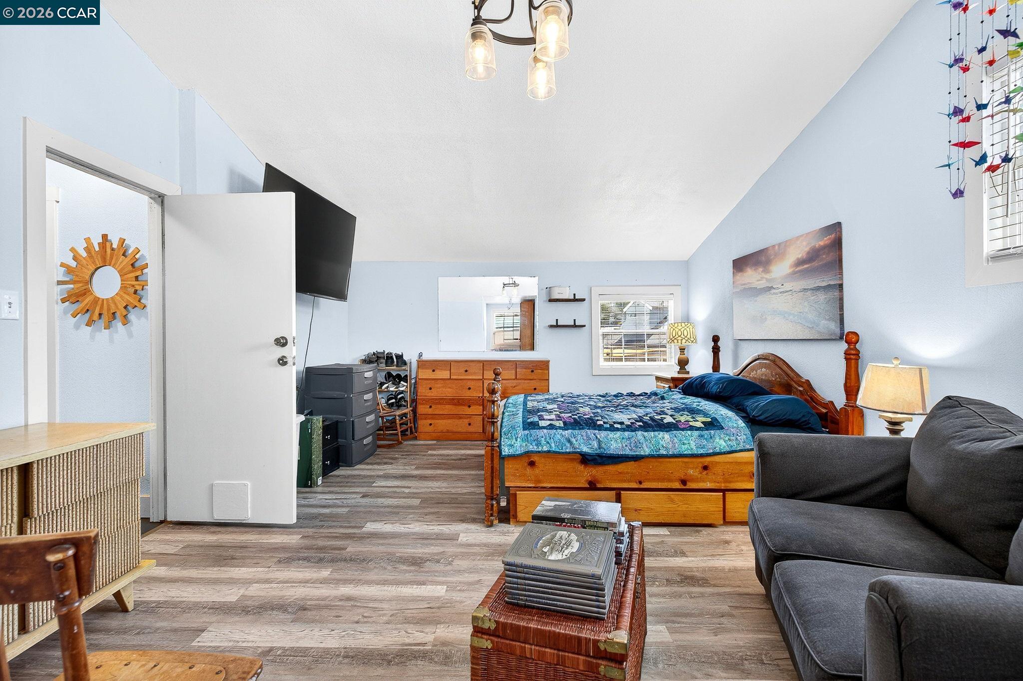 2312 Granada Court Pinole, CA 94564 - Photo 22 of 60 a living room with furniture and a flat screen tv