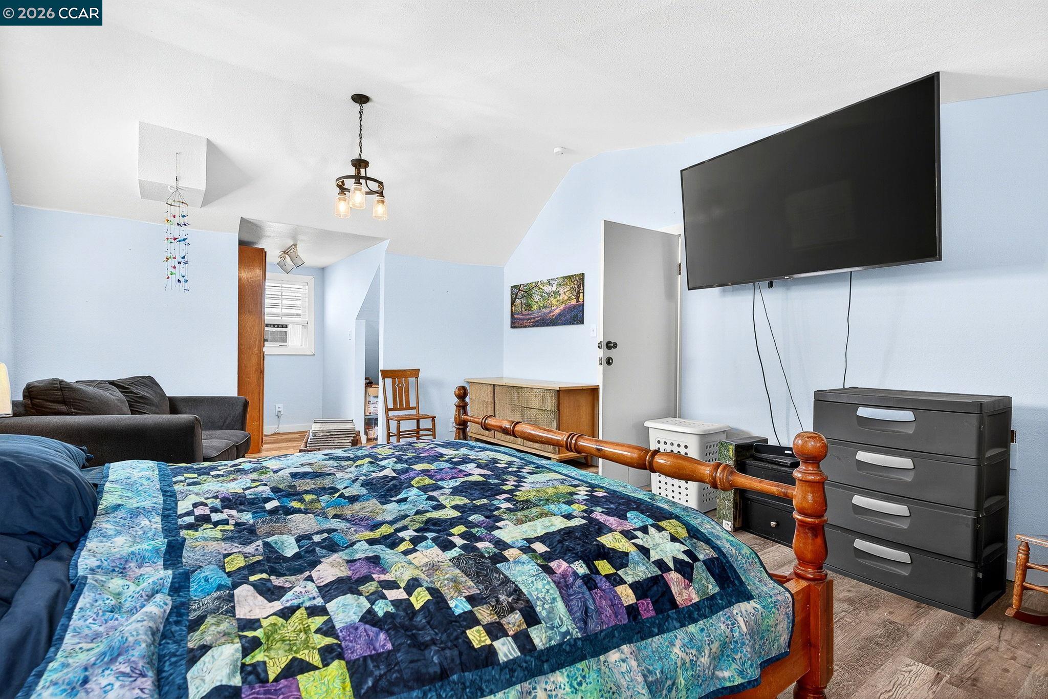 2312 Granada Court Pinole, CA 94564 - Photo 25 of 60 a bedroom with a bed and flat screen tv