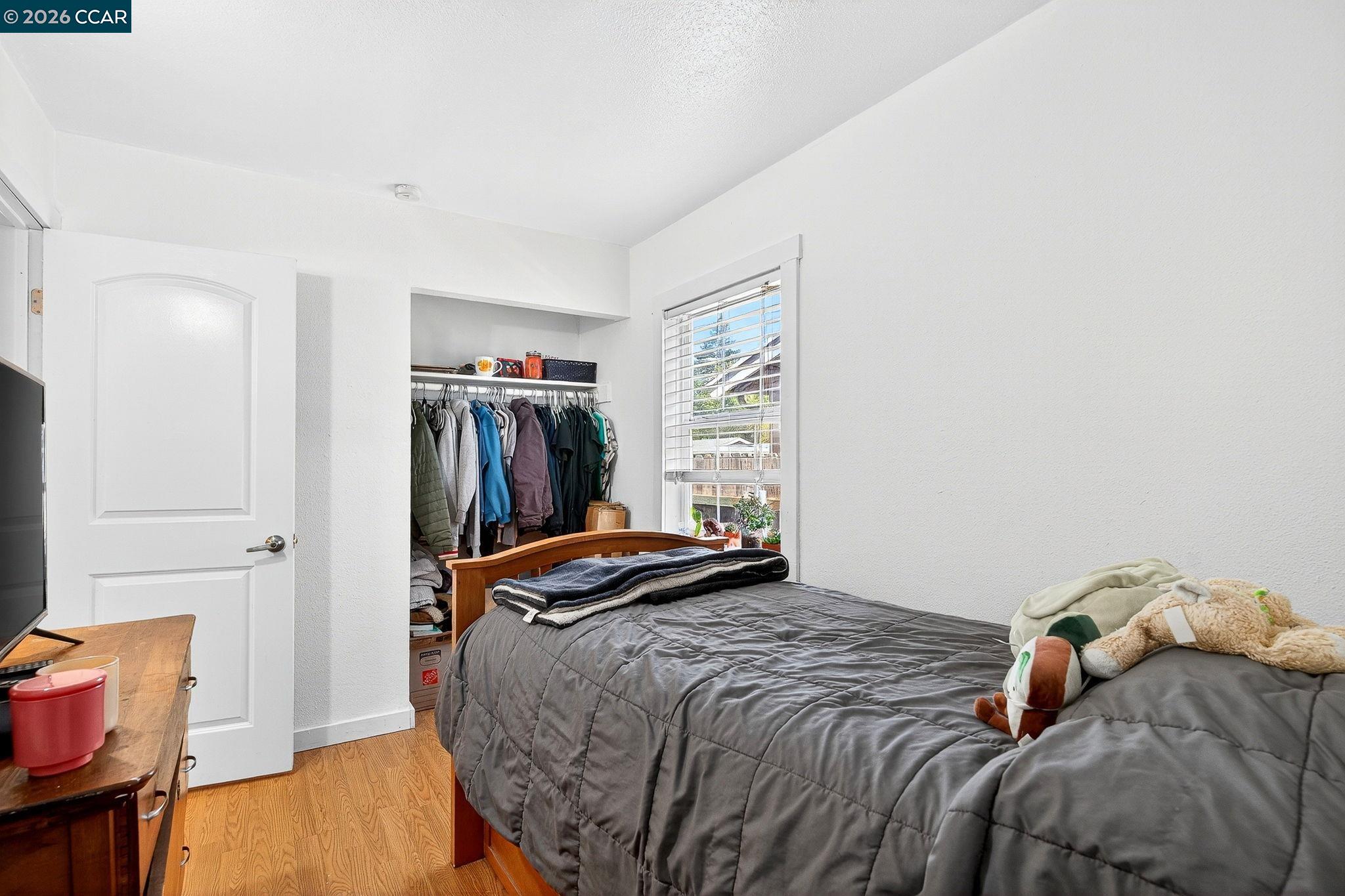 2312 Granada Court Pinole, CA 94564 - Photo 34 of 60 a bedroom with a bed and a closet