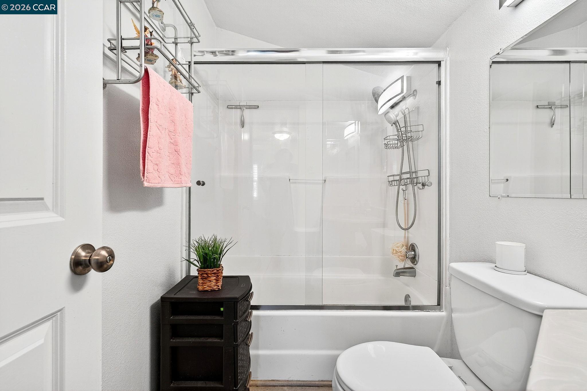 2312 Granada Court Pinole, CA 94564 - Photo 36 of 60 a bathroom with a shower toilet and sink