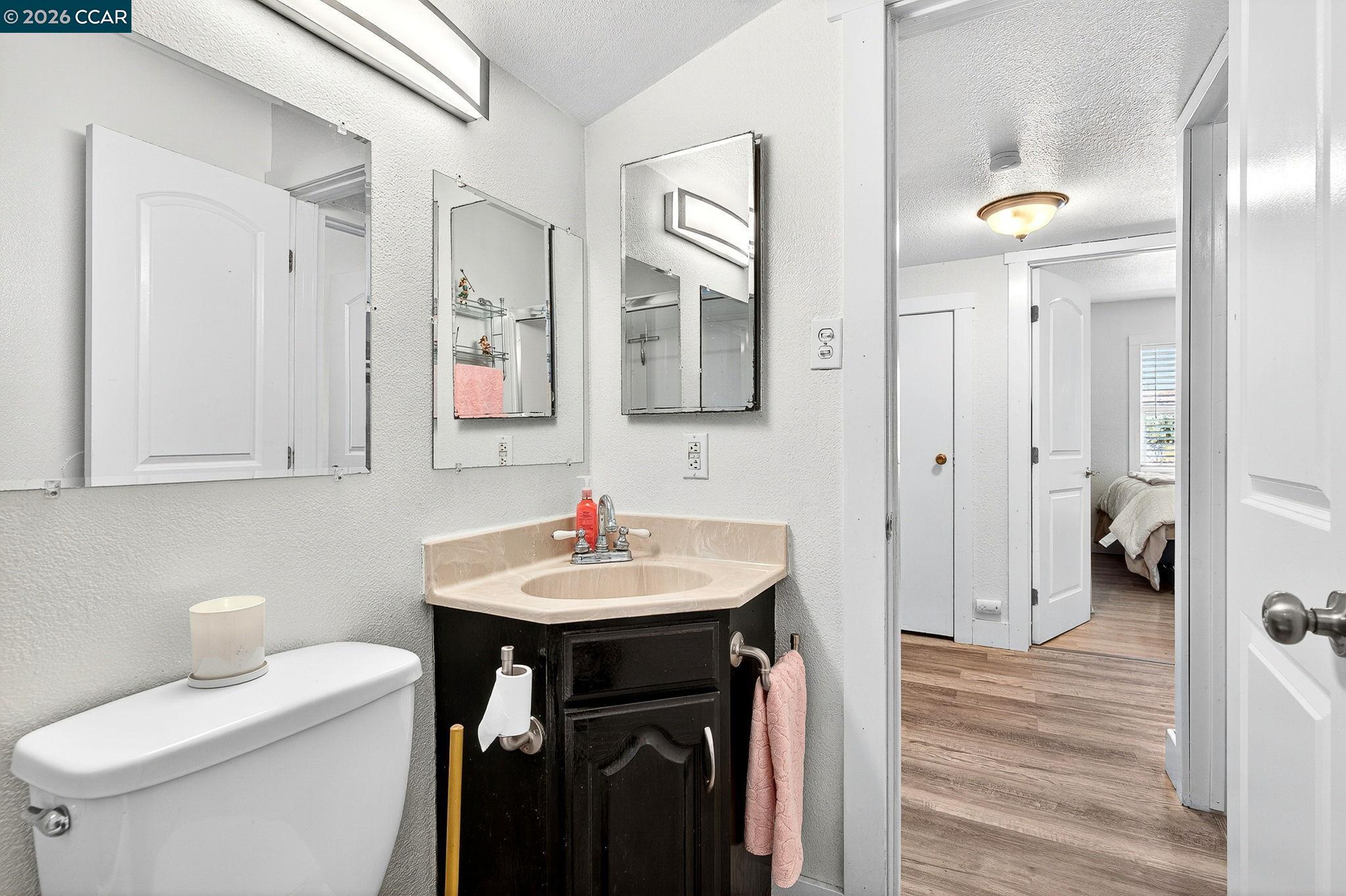 2312 Granada Court Pinole, CA 94564 - Photo 37 of 60 a bathroom with a sink toilet and shower