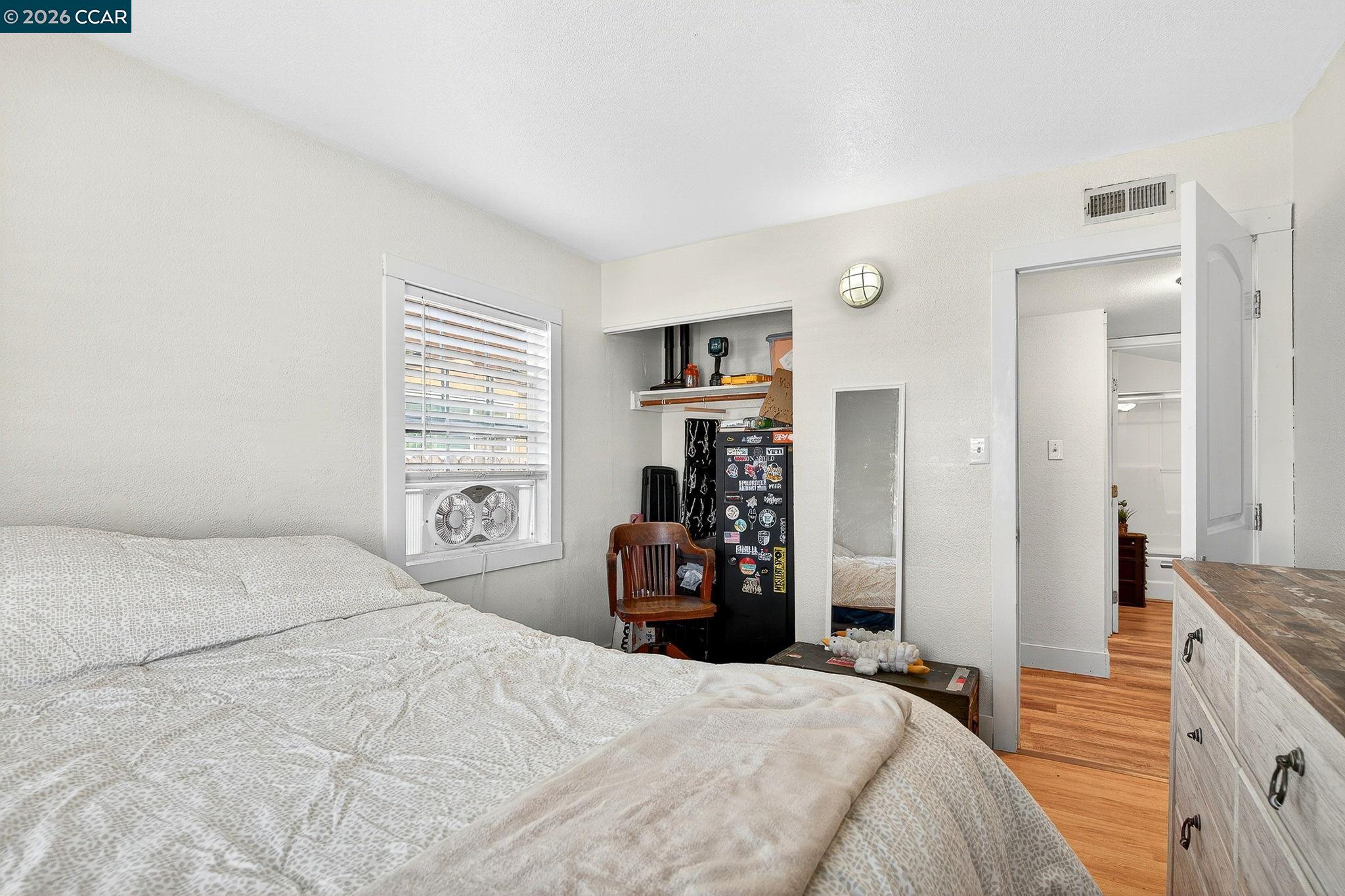 2312 Granada Court Pinole, CA 94564 - Photo 39 of 60 a bedroom with a bed and a refrigerator