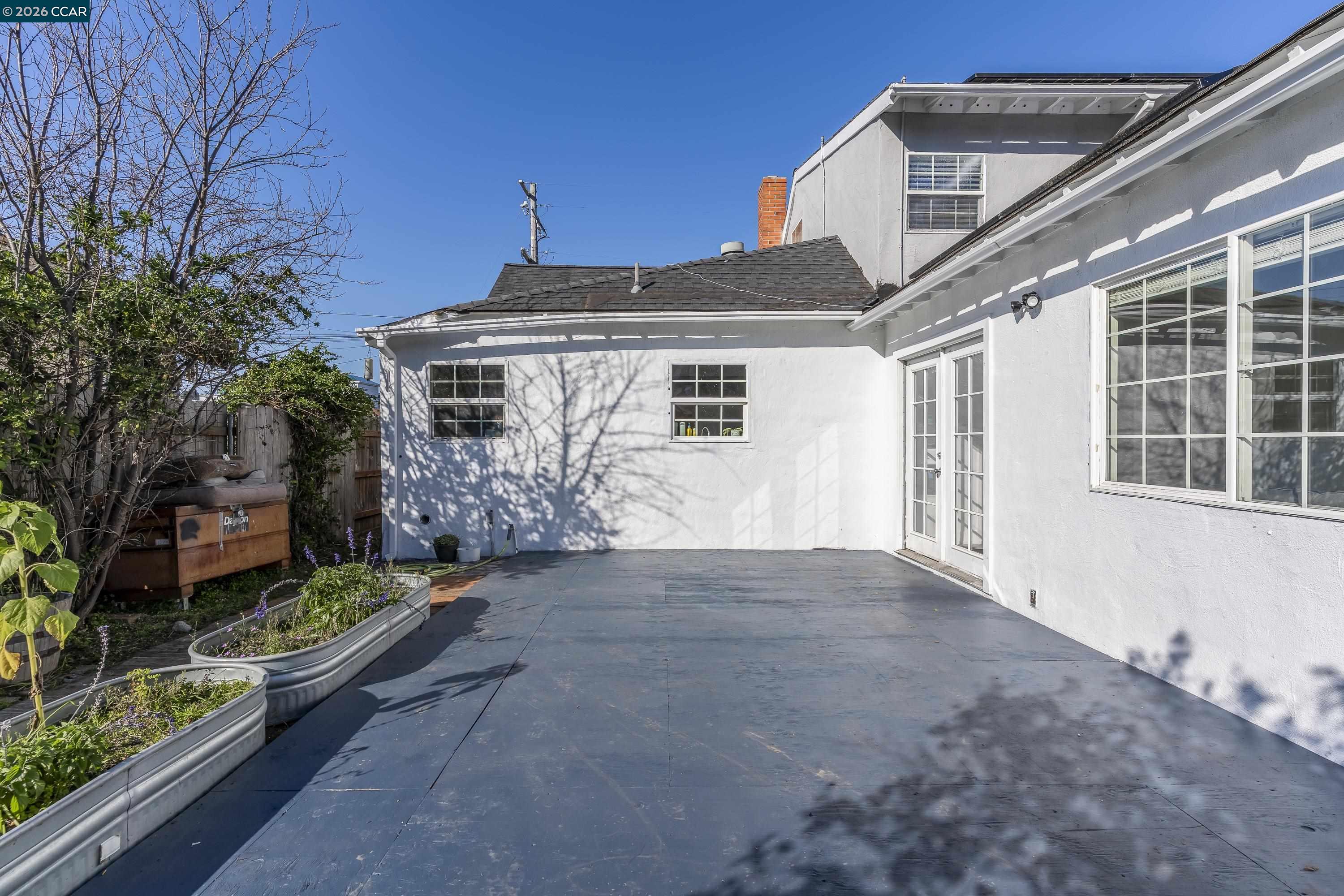 2312 Granada Court Pinole, CA 94564 - Photo 46 of 60 a view of a house with a yard and potted plants