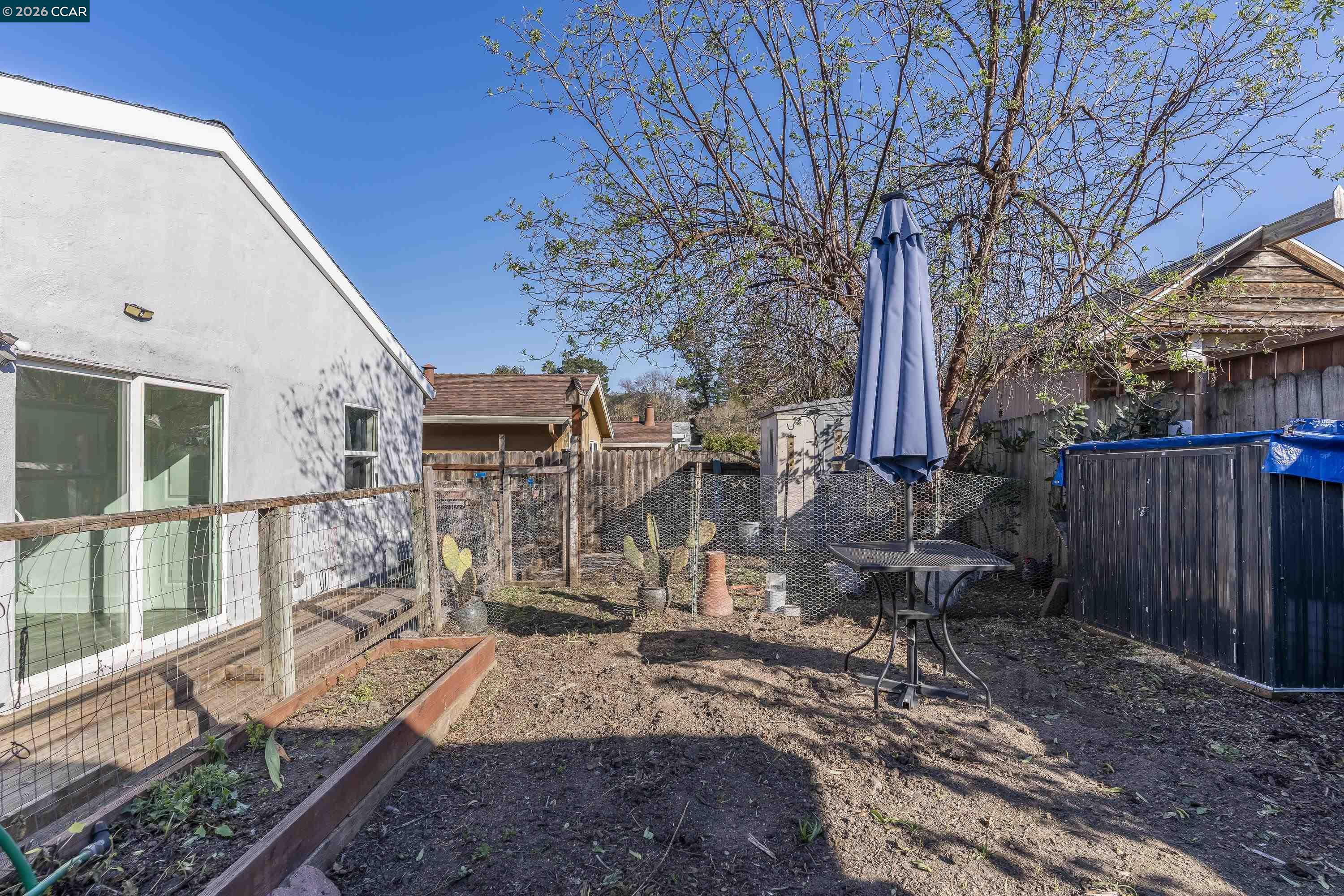 2312 Granada Court Pinole, CA 94564 - Photo 53 of 60 a view of a house with backyard and wooden fence