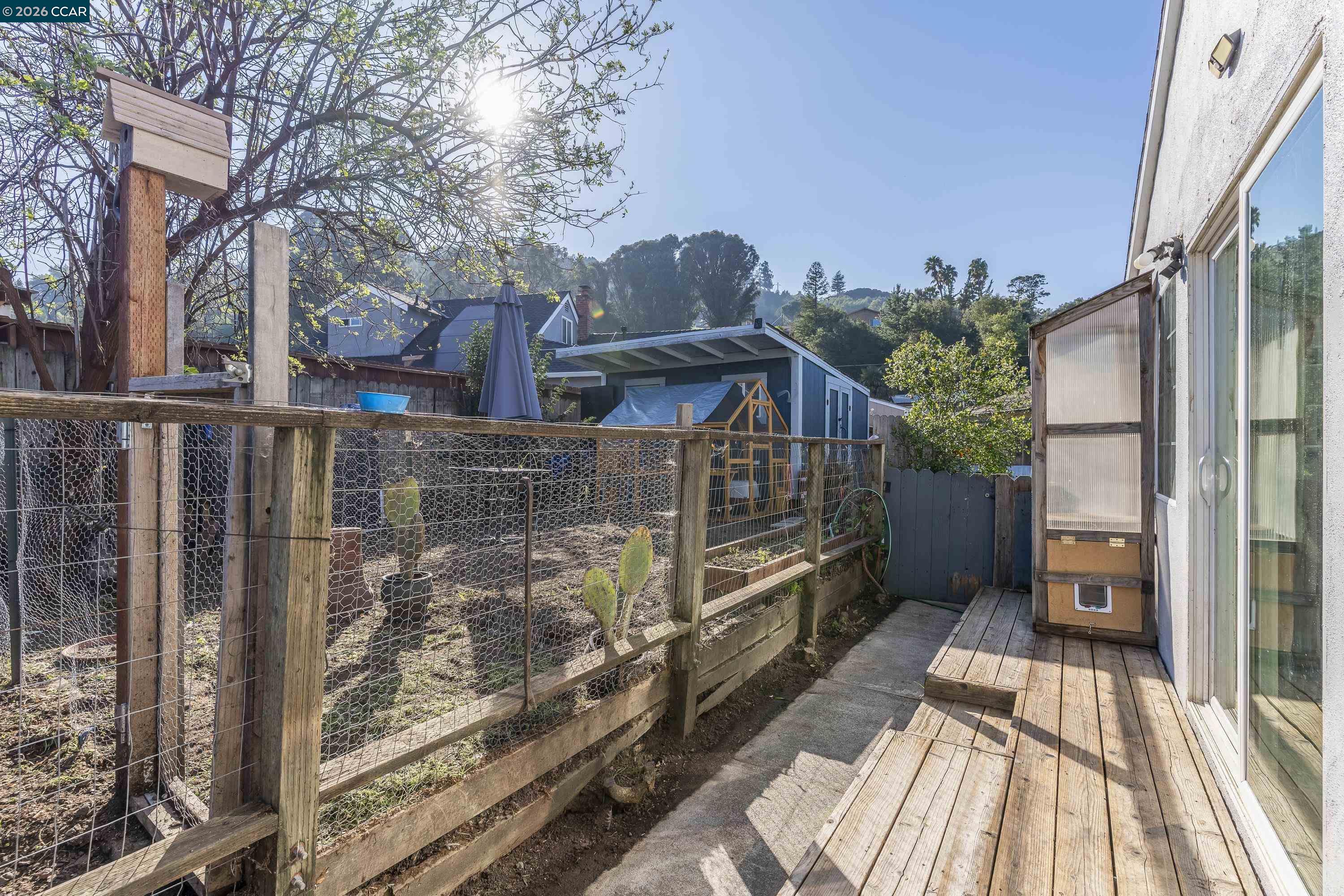 2312 Granada Court Pinole, CA 94564 - Photo 56 of 60 a view of a house with a wooden fence