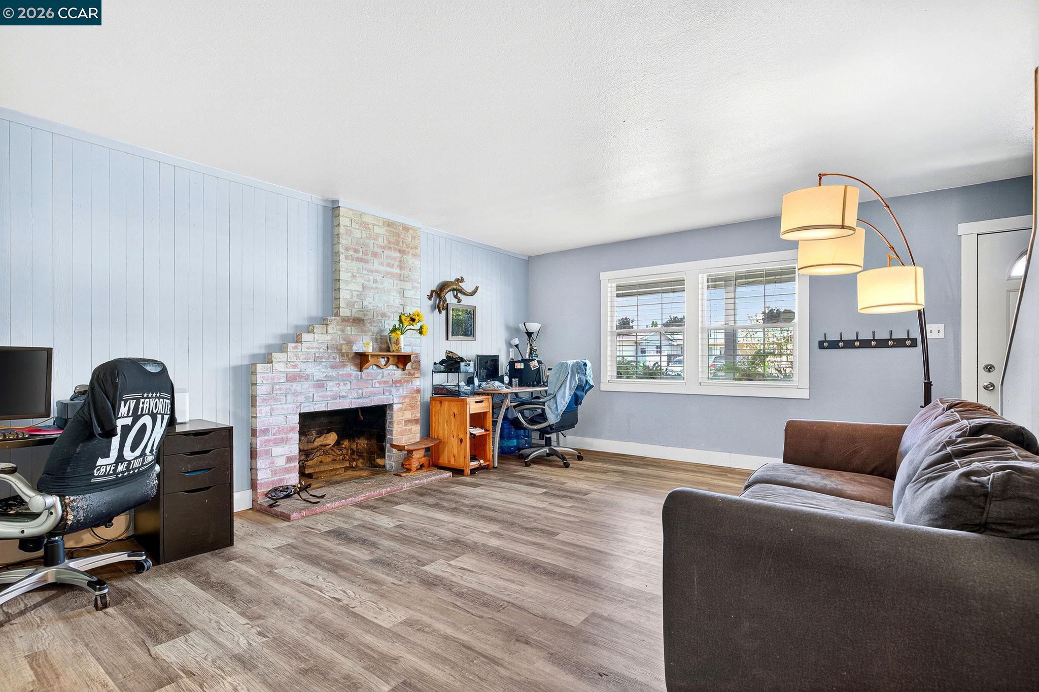 2312 Granada Court Pinole, CA 94564 - Photo 6 of 60 a living room with furniture and a fireplace