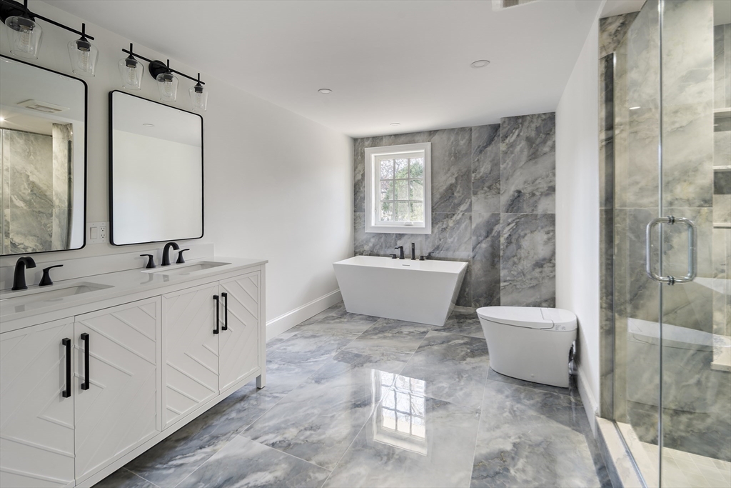 Lot 50 Barnard Hill Road Boylston, MA 01505 - Photo 20 of 30 a bathroom with a double vanity sink mirror and bathtub