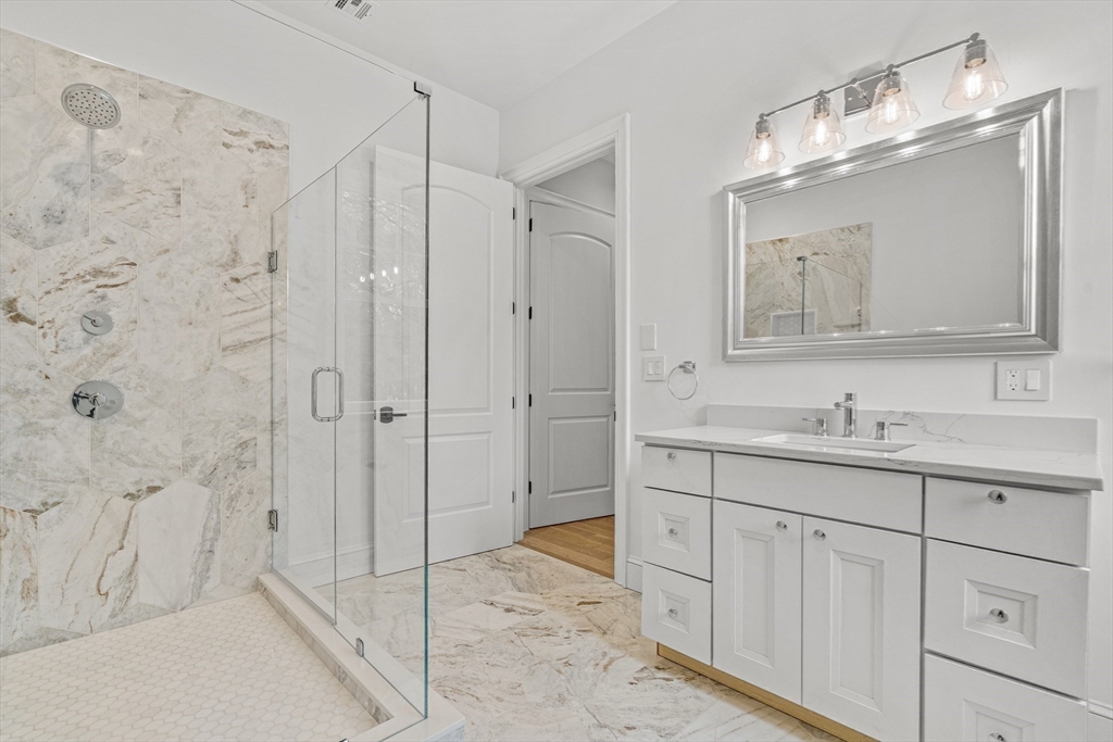 Lot 50 Barnard Hill Road Boylston, MA 01505 - Photo 23 of 30 a bathroom with a granite countertop sink a mirror a shower and a bathtub