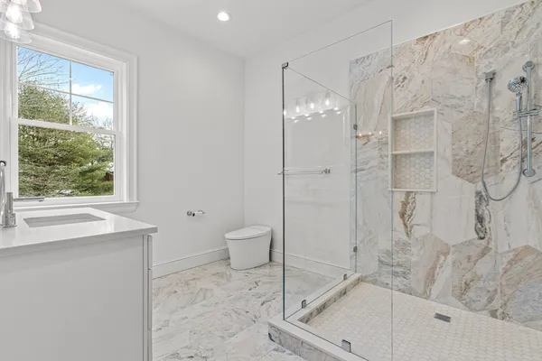 a bathroom with a bathtub and a shower