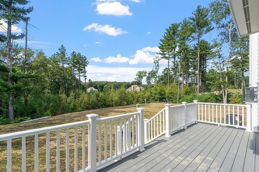Lot 50 Barnard Hill Road Boylston, MA 01505 - Photo 30 of 30 a view of a balcony with wooden floor and fence
