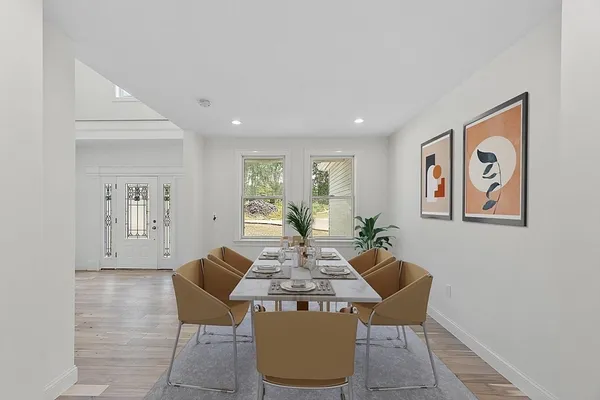 a view of a dining room with furniture window and wooden floor
