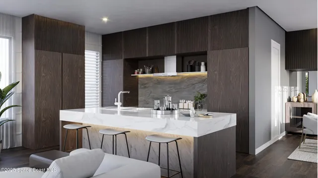 a kitchen with kitchen island granite countertop a sink cabinets and refrigerator