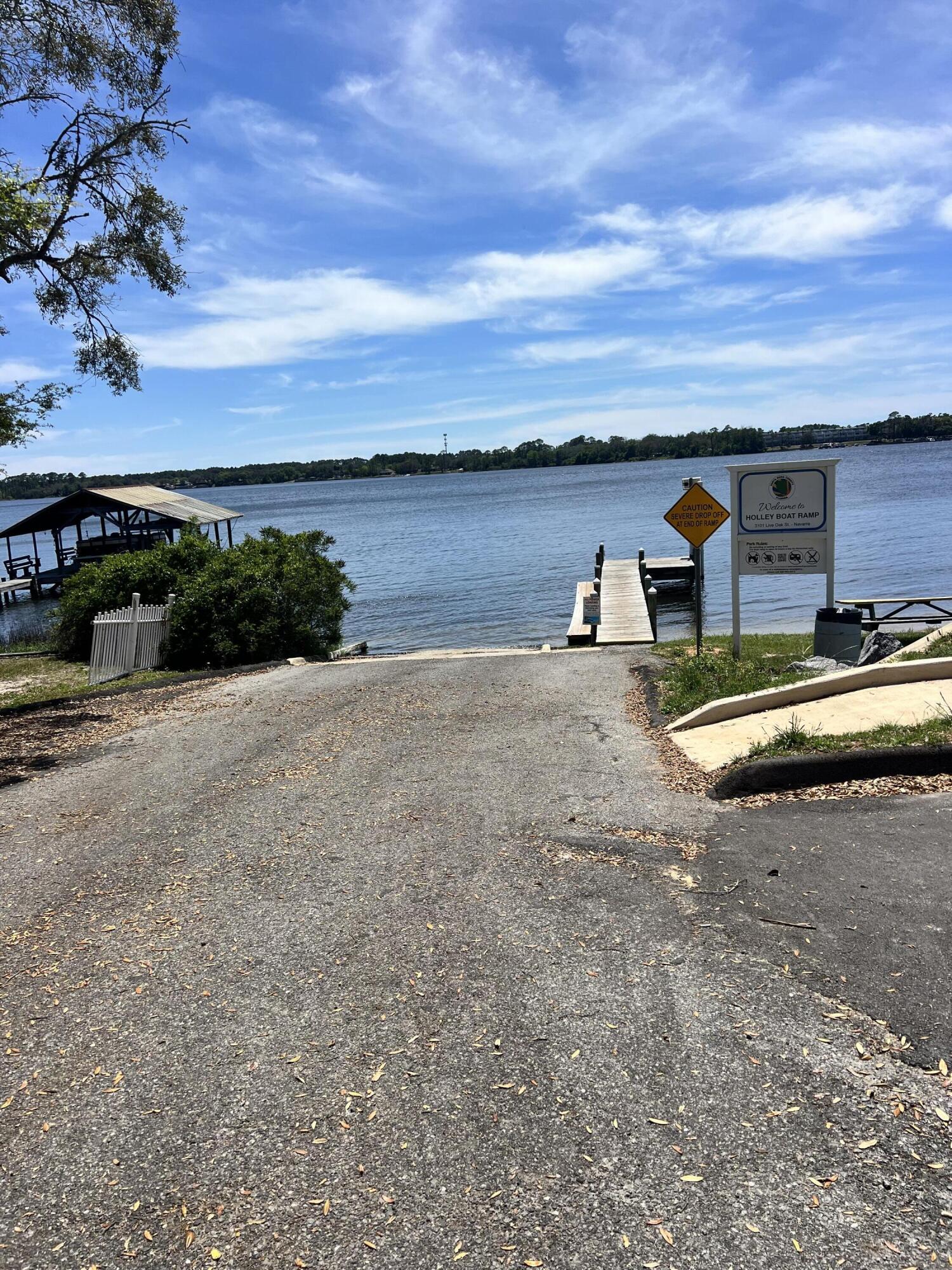 0 Hickory Street Navarre, FL 32566 - Photo 2 of 5 a view of a lake with outdoor space